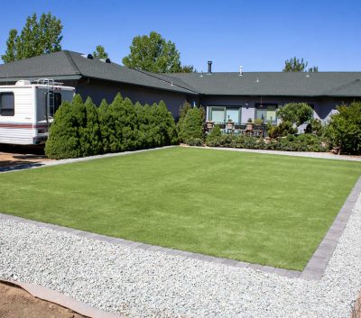 turf and river rock installation